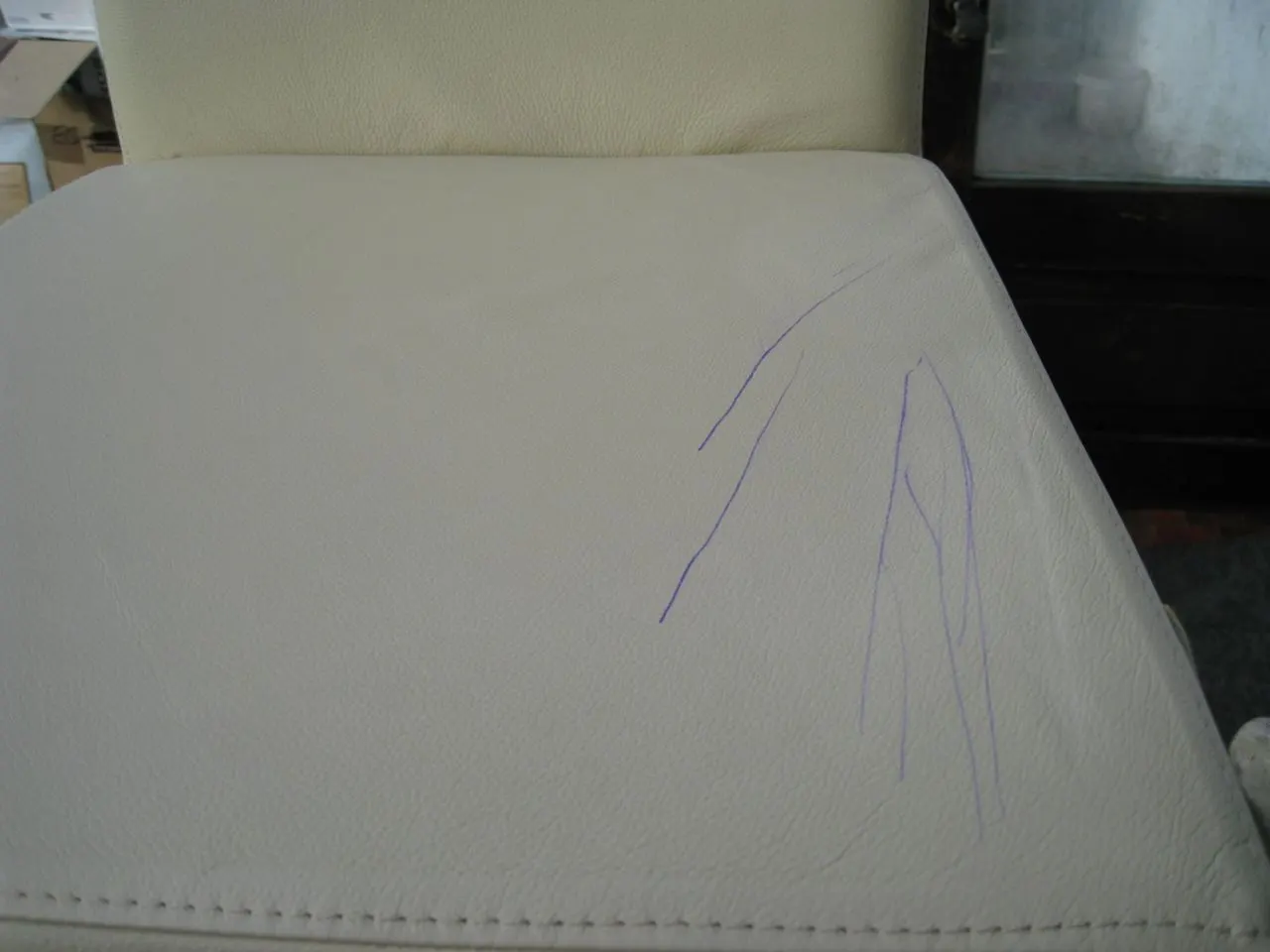 Scuffed leather repaired and recoloured by Leathermend Yorkshire