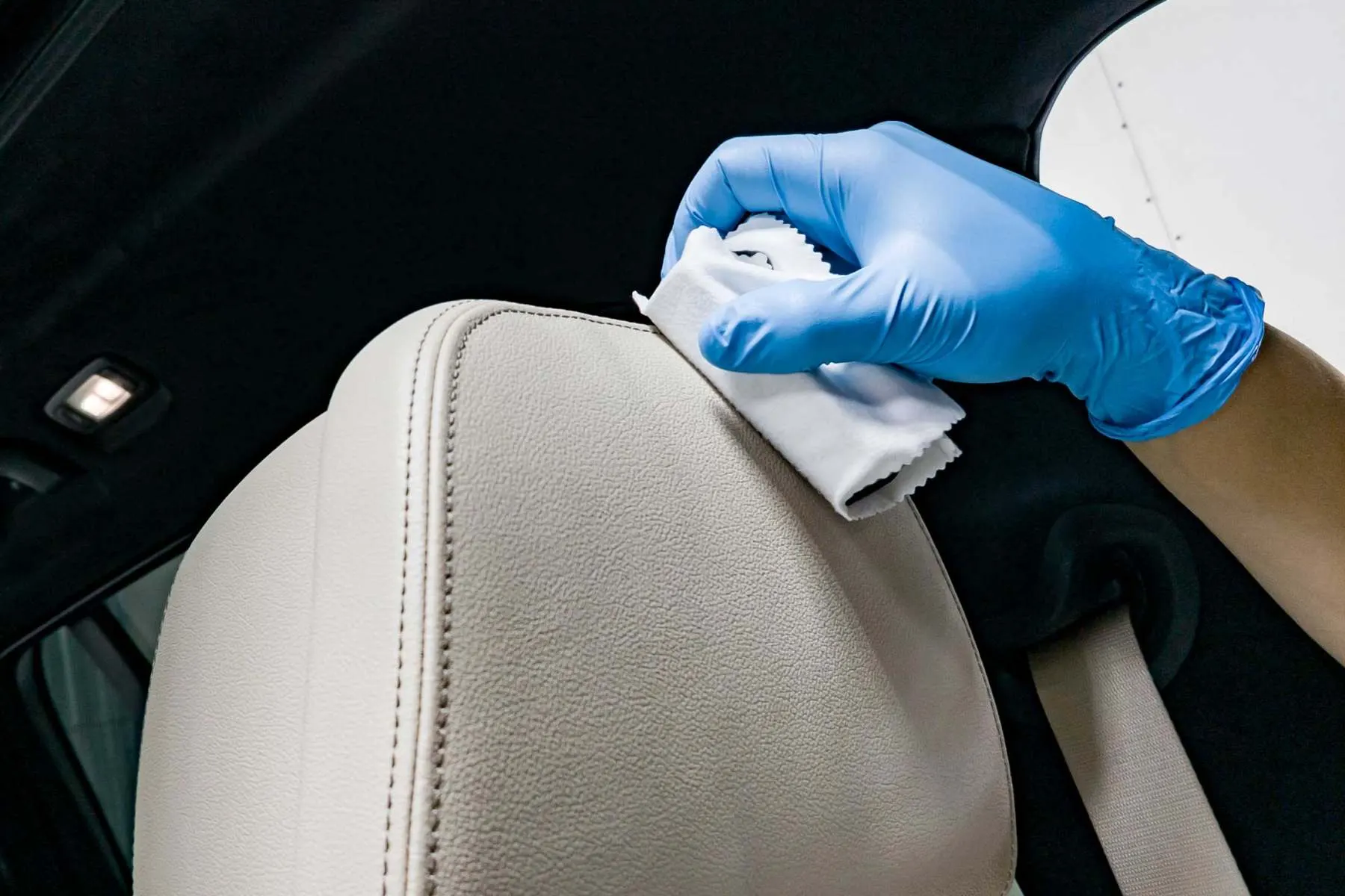 Leather car seat being cleaned by hand, Leathermend Halifax