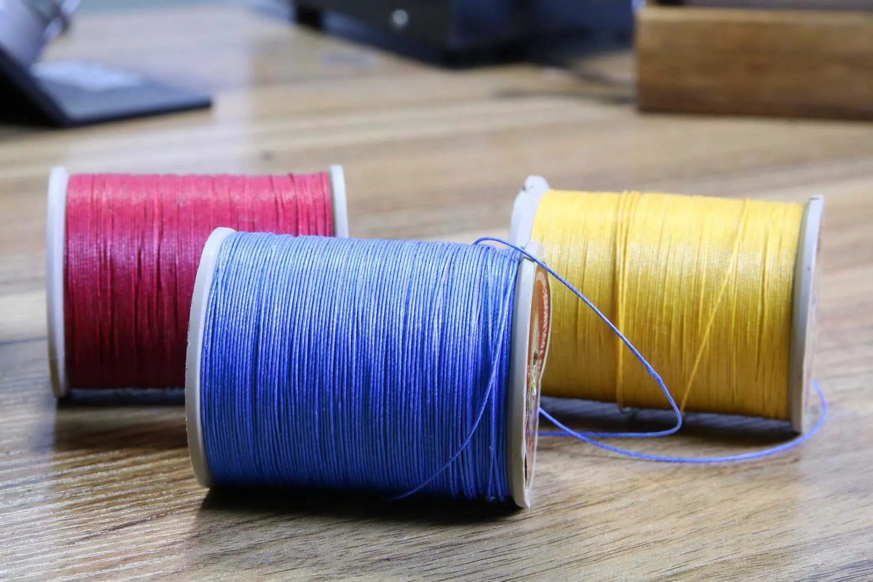 Waxed leather threads in the Leathermend workshop, Halifax